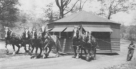 Scanned image of refreshment stand being moved in North Park.