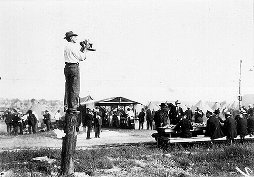 Photo of Frank Bingaman taking a photograph.