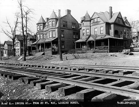 Photo_of_housing_along_railroad_tracks.
