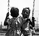 Thumbnail:_Photo_of_two_young_girls_on_swing_(detail).