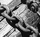 Thumbnail: Scanned photo of utility poles on trailer (detail).