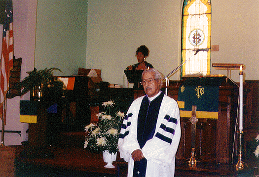 Scanned photo of Bishop Colgate during a worship service.