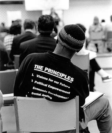 Back view of
t-shirted participant at '96 conference.